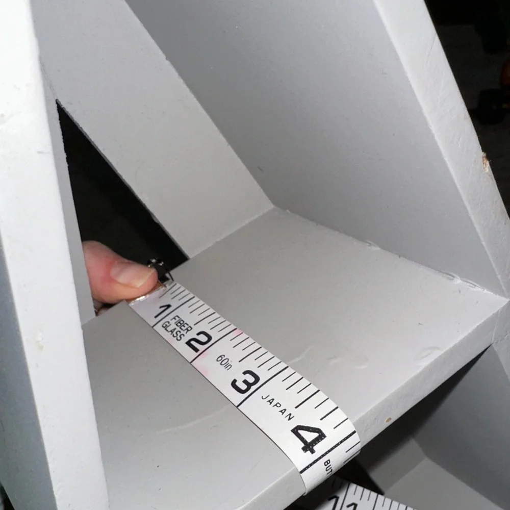 Belk Gray Triangular Display Shelf with Hooks